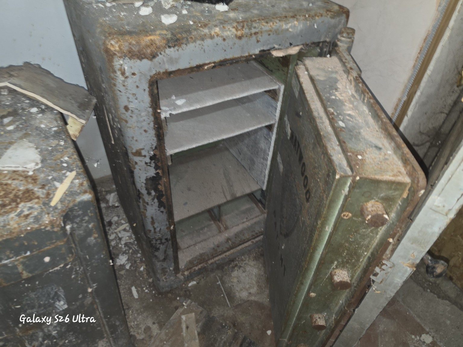Asbestos insulating board lining and shelving inside an old safe
